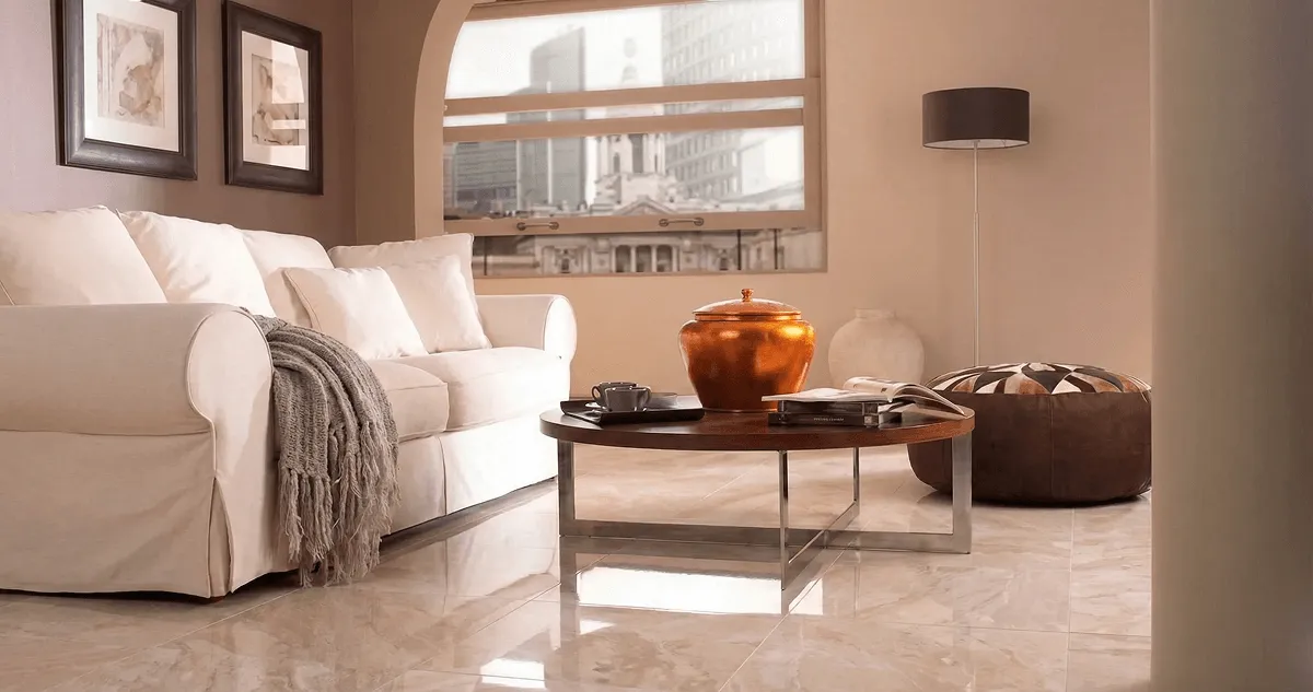 Modern living room with professionally installed marble flooring, a beige sofa, coffee table in Columbia, SC